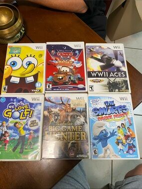 Lot of 6 Nintendo Wii Games - SpongeBob, Cars, WWII Aces, Golf, Cabela's, Smurfs